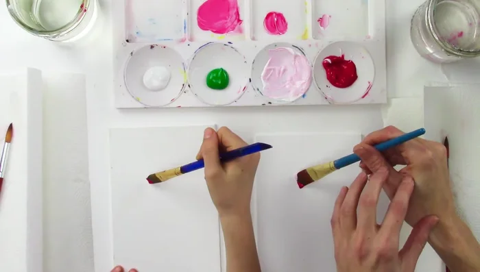 Start in the middle of your canvas, using only your fingers to twist the brush and create the rose's center. Practice this technique until you achieve a smooth, blended effect.