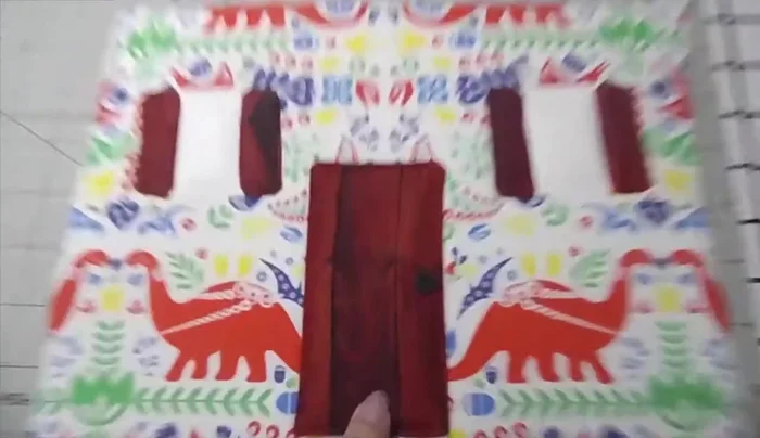 Sew the exterior fabric pieces together, leaving the bottom open. Attach the roof pieces.