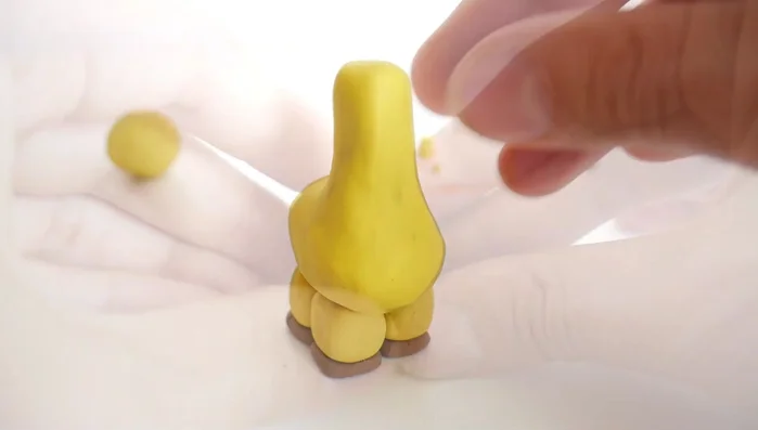 Attach the legs to the body.