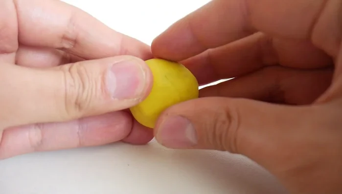 Attach brown clay hooves to the bottom of each leg.