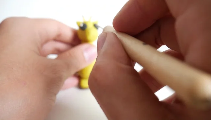 Make nostrils using a stick or pointed tool.