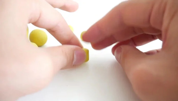 Attach brown clay hooves to the bottom of each leg.