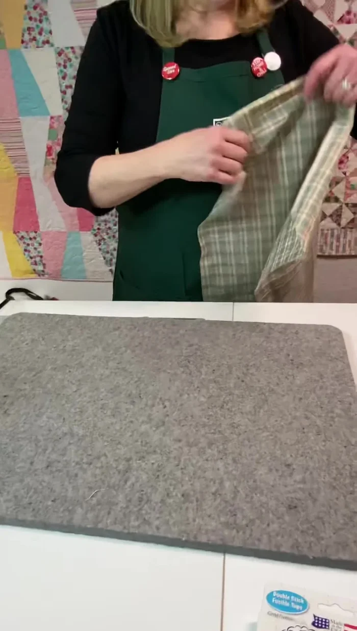 Fold over the edges, using the tape as a guide, and press to secure.