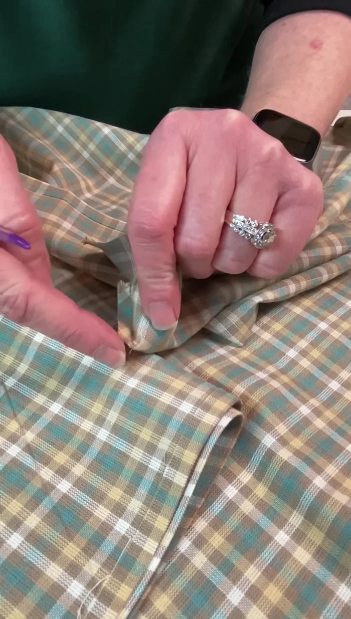 Clip the corners to reduce bulk, press open the seams, and use a tool (like an awl) to poke out the corners for a sharp edge.