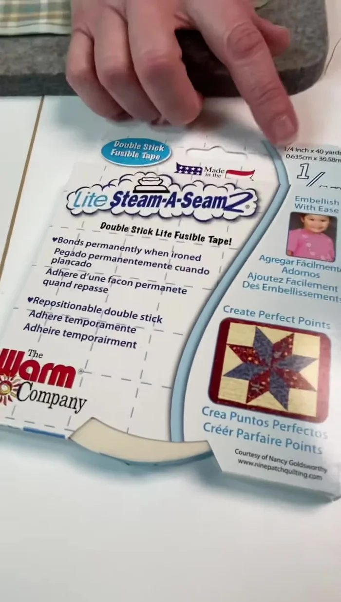 Fold over the edges, using the tape as a guide, and press to secure.