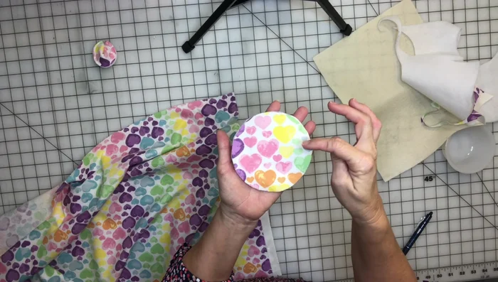 Place fabric and felt circles wrong sides together. Sew a ½ inch seam around the circle using a straight stitch (3.0 stitch length recommended). Use needle down/pivot technique for smooth curves.