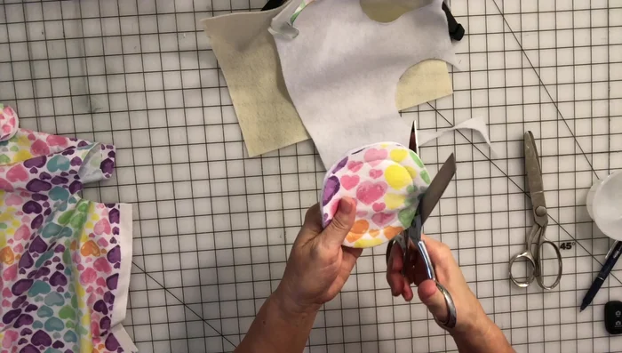 Fold the sewn circle in half, then in half again to find the center. Mark the center (optional).