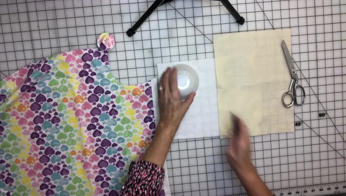 Trace your circle pattern onto fabric and felt, then cut out the circles.