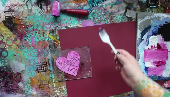 Repeat the stamping process, adjusting the paint amount for desired results. The foam underneath the paper acts as a cushion.