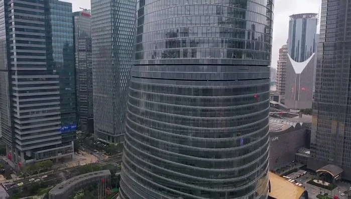 The Shard, London: A tall skyscraper with angled glass facades reflecting sunlight, creating a changing appearance.