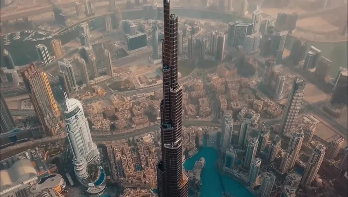 The Shard, London: A tall skyscraper with angled glass facades reflecting sunlight, creating a changing appearance.