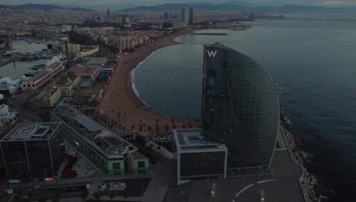 Hotel W Barcelona: A five-star hotel designed like a sail, covered in glass for natural light and Mediterranean Sea views.