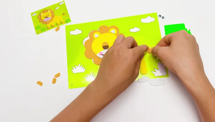 Add background elements (clouds and grass).