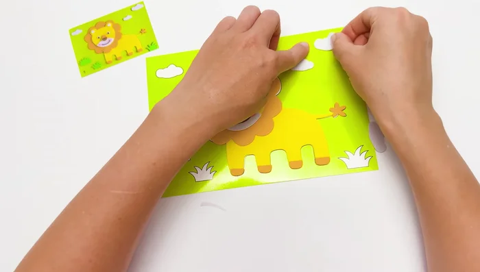 Add background elements (clouds and grass).