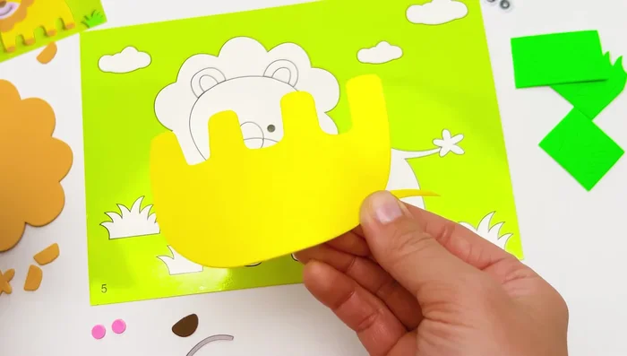 Place the head sticker on top of the body.