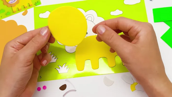 Place the head sticker on top of the body.