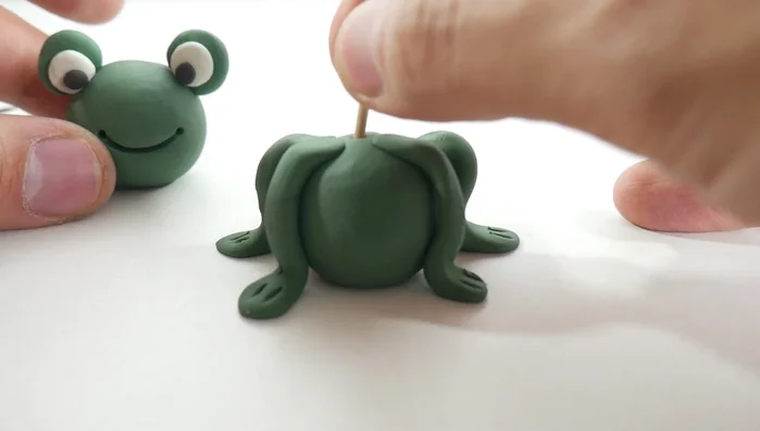 Attach the head: Attach the head to the body, using a toothpick to secure it. [244.56]