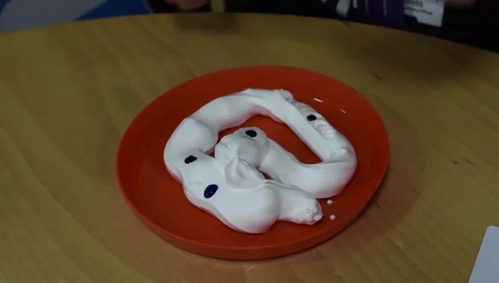 Gently swirl the colors together with a stirrer, avoiding complete blending.