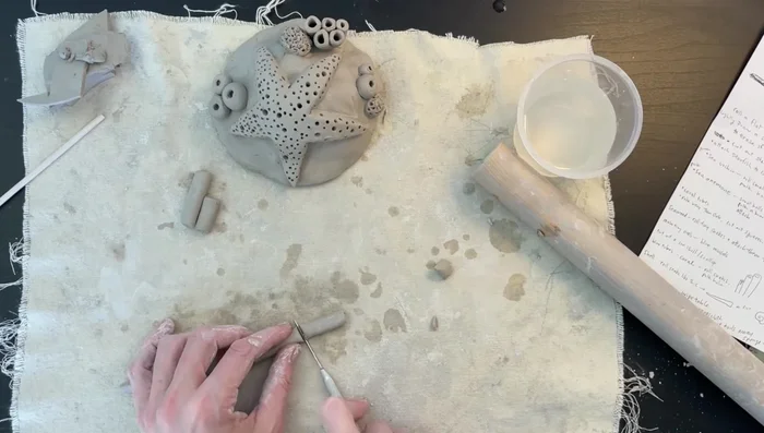 Alternative coral method: Roll out thin snakes of clay, chop into cylinders, and attach to create different coral shapes. Remember to use score and slip method.