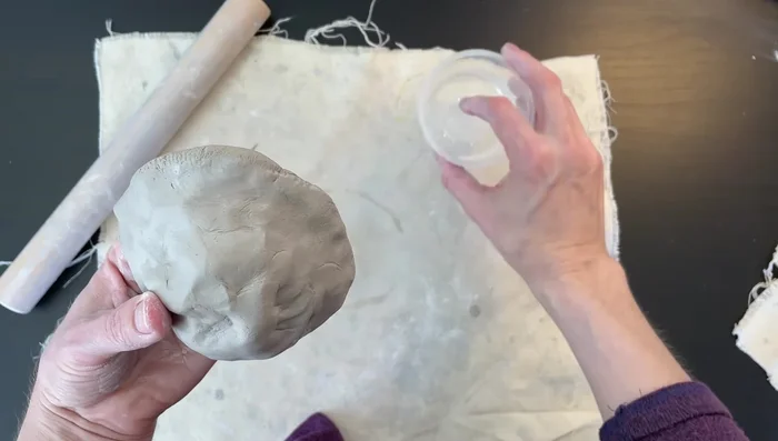 Smooth the clay: Use a wet finger to smooth out any rough areas on the clay.