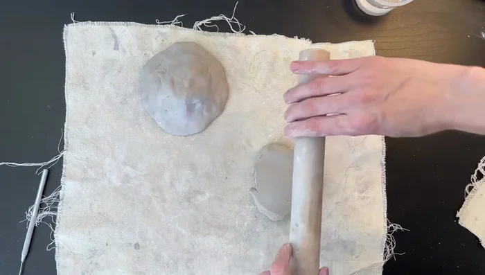 Attach starfish: Score both the mound and the back of the starfish using cross-hatching. Apply water to both scored surfaces, and firmly press the starfish onto the mound.