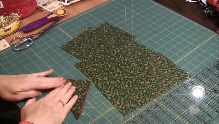 Cut the Triangles: Hold the folded triangle securely and cut three lines, stopping before reaching the end to create triangle shapes.