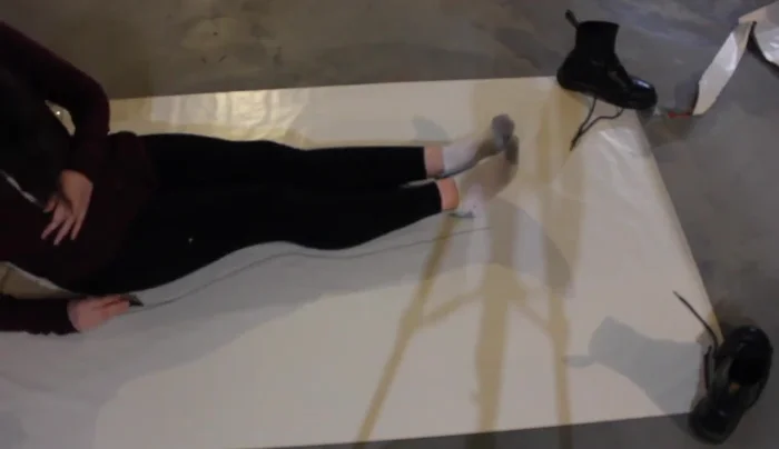 Create the tail pattern: Trace around your legs and monofin onto a large piece of paper.