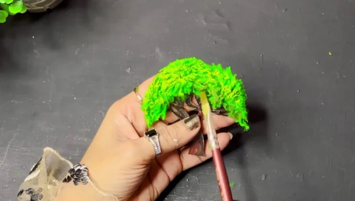 Stick pearl beads (painted or unpainted) onto the tree using a hot glue gun.