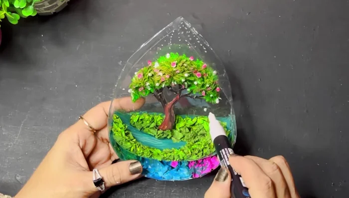 Draw white dots/balls on the tree using a Posca marker.