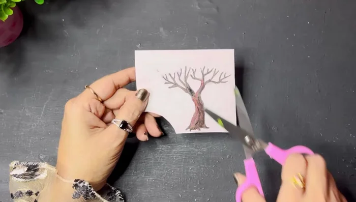 Stick pearl beads (painted or unpainted) onto the tree using a hot glue gun.