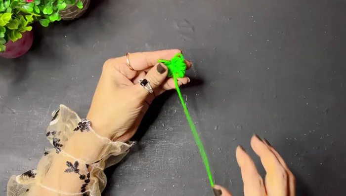 Stick pearl beads (painted or unpainted) onto the tree using a hot glue gun.