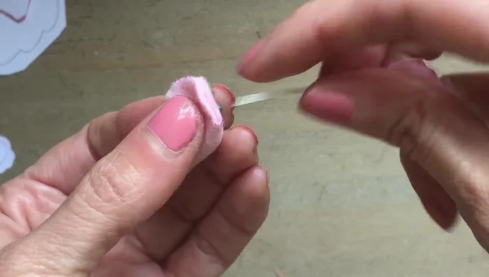 Cut out the felt for the base of the teacups and glue it to the base of each cup.