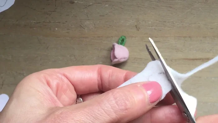 Cut out the felt for the base of the teacups and glue it to the base of each cup.