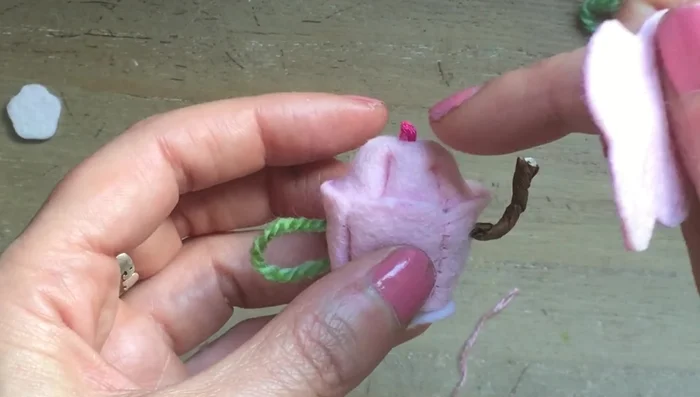 Turn out the lid. Create a tray by cutting out a leaf shape from felt and blanket stitching around the edges.