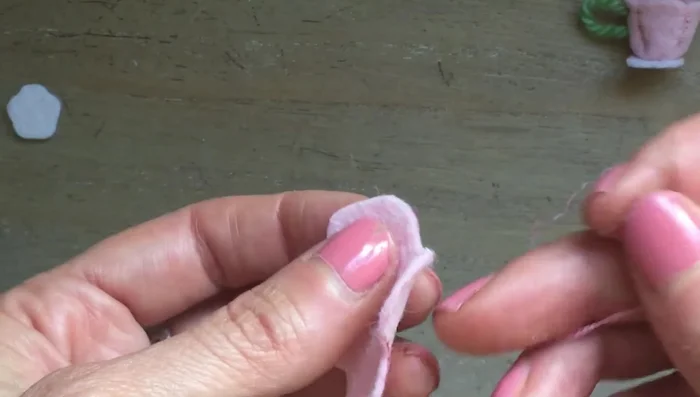 Turn out the lid. Create a tray by cutting out a leaf shape from felt and blanket stitching around the edges.