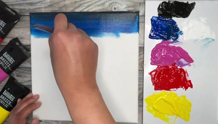 Double load with remaining Phthalo Blue and Medium Magenta to create a purplish tone.