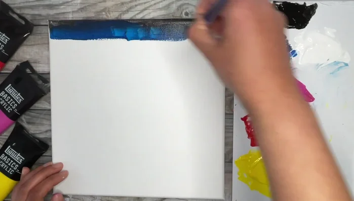 Double load with remaining Phthalo Blue and Medium Magenta to create a purplish tone.