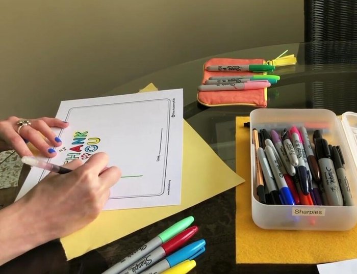 Add smaller half-circles inside the petals in a darker color to create a pattern.