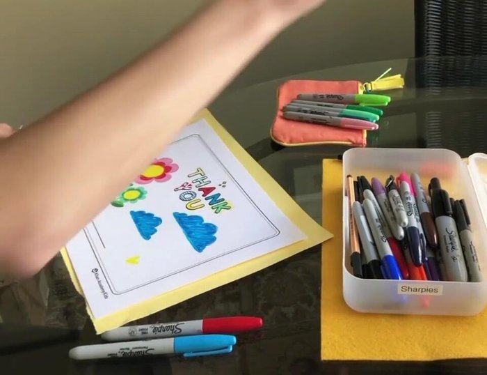 Write your name and a thank you message inside the card.