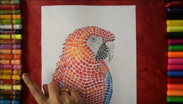 Color the background using oil pastels.