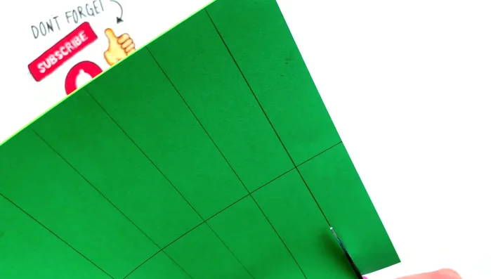 Cut the paper strips: Cut each section in half while keeping the papers aligned to maintain order.