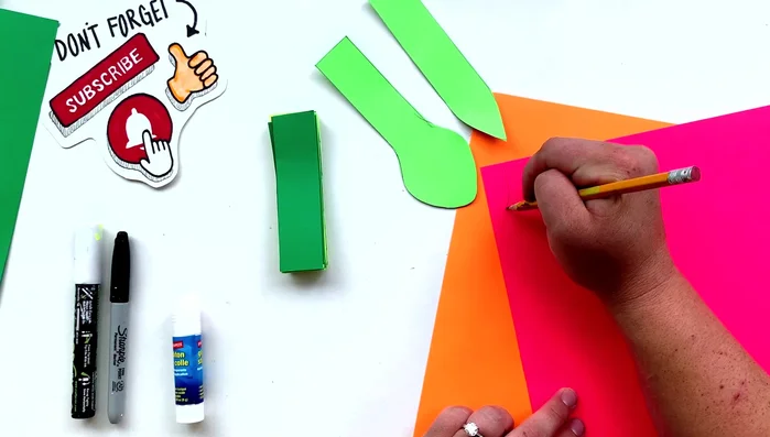 Add details: Draw and cut out a tongue and two eyes for your snake.