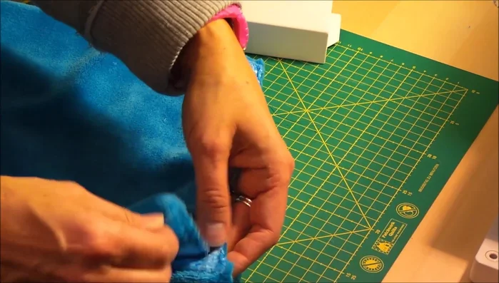 Place fabrics together again, and sew the top edge using a sewing machine. Leave a few inches unsewn at each end.