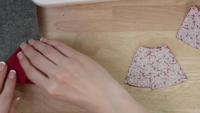 Tack ribbon to top corners of both lining and outer fabric.