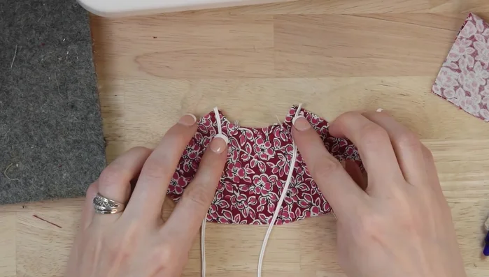 Tack ribbon to top corners of both lining and outer fabric.