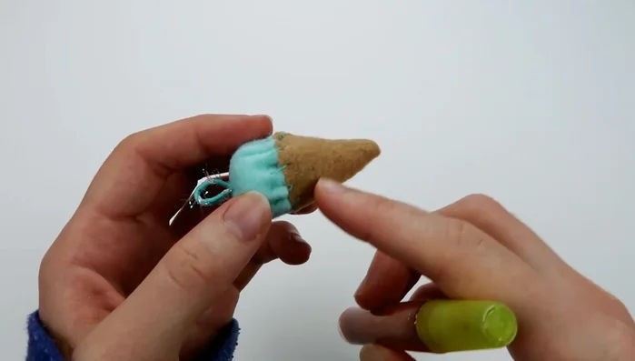 Optional: Apply glitter glue to the cone and let it dry completely.