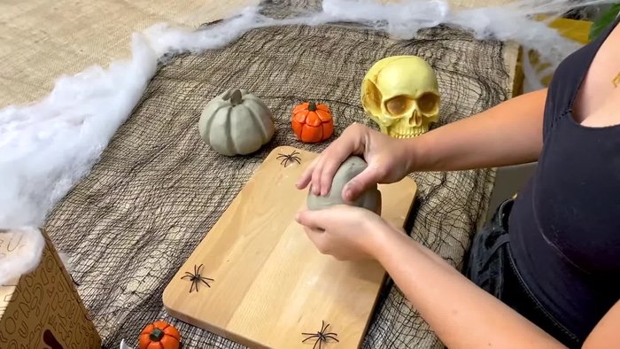 Prepare the clay: Tear off a piece for the stem and split the rest in half.