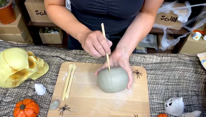 Carve the ridges: Use a knife tool to carve in the pumpkin's ridges. Vary the width between ridges for a more natural look.