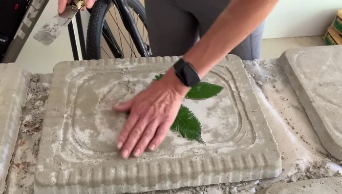 Clean stones: Gently scrape away any leaves that are stuck to the cement.