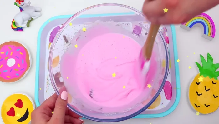 Slowly add contact solution, mixing thoroughly after each addition, until the slime comes together and is no longer sticky.